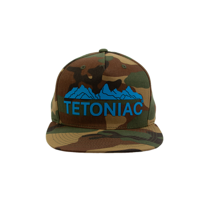 PAKO DESIGNS - TETONIAC® 5 PANEL FLAT BILL TWILL TRUCKER HAT - WOODLAND CAMO / MALIBU BLUE SILICONE