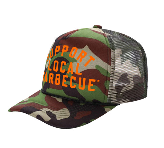 PAKO DESIGNS - SUPPORT LOCAL BARBECUE™ - CAMO TRUCKER HAT WITH HUNTER ORANGE